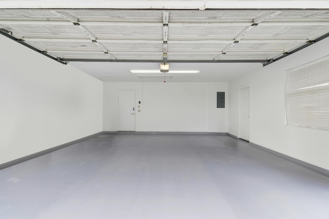 1365 Wilderness Rd, West Palm Beach, FL 33409 - garage featuring electric panel and baseboards