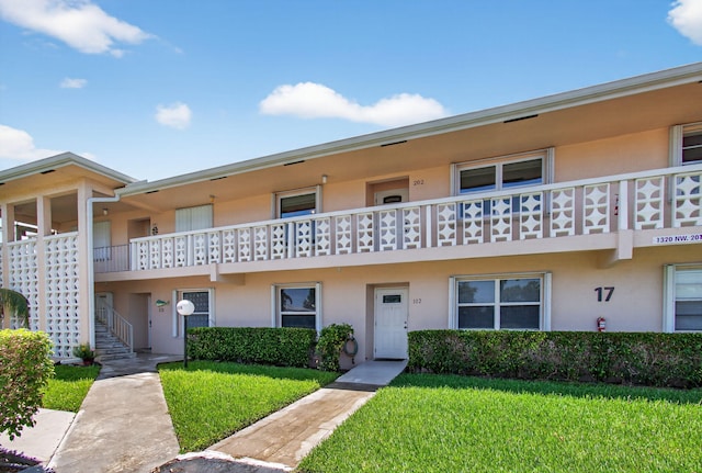 1320 NW 20th Ave Unit 202, Delray Beach, FL 33445 - view of property featuring stairway