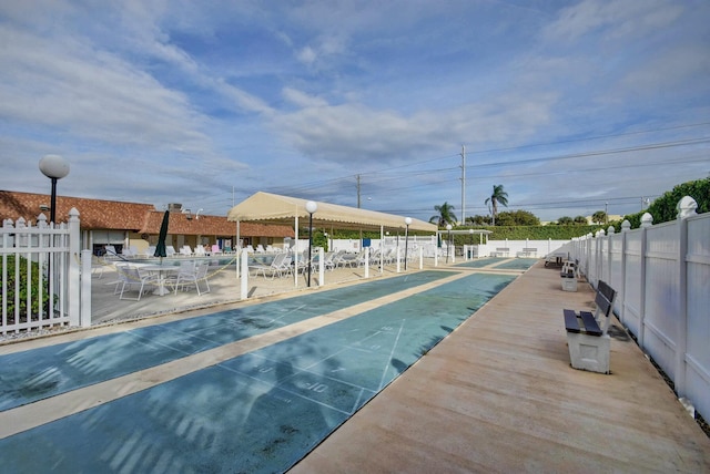 1320 NW 20th Ave Unit 202, Delray Beach, FL 33445 - view of swimming pool featuring shuffleboard