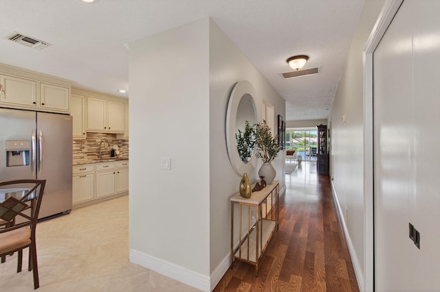 1320 NW 20th Ave Unit 202, Delray Beach, FL 33445 - corridor with light wood finished floors and recessed lighting