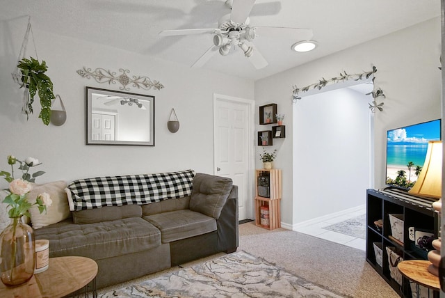 3283 SE W Snow Rd, Port Saint Lucie, FL 34984 - carpeted living area with a ceiling fan and baseboards