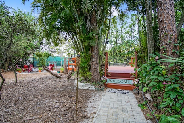 3283 SE W Snow Rd, Port Saint Lucie, FL 34984 - view of yard featuring a deck