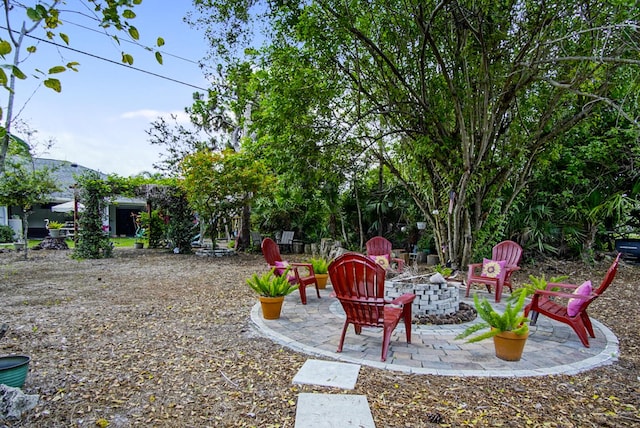 3283 SE W Snow Rd, Port Saint Lucie, FL 34984 - view of yard featuring a fire pit and a patio area