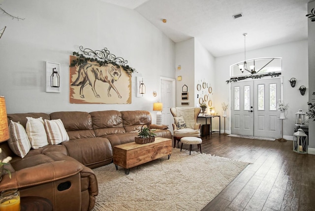 3283 SE W Snow Rd, Port Saint Lucie, FL 34984 - living room with high vaulted ceiling, wood-type flooring, and a chandelier