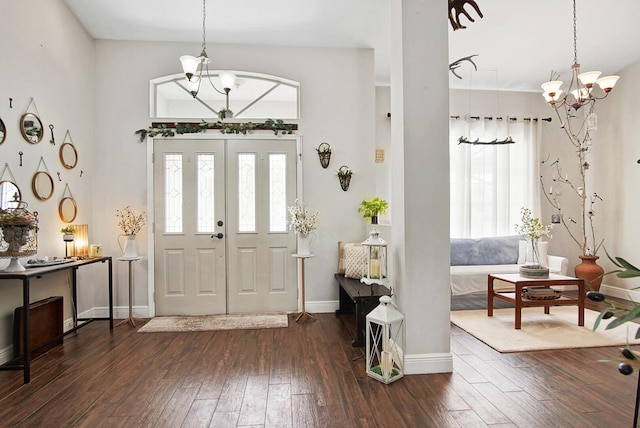 3283 SE W Snow Rd, Port Saint Lucie, FL 34984 - foyer featuring a chandelier and dark wood-style floors