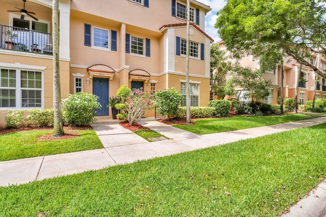 4616 Danson Way, Delray Beach, FL 33445 - view of property with stucco siding, a front lawn, and a ceiling fan