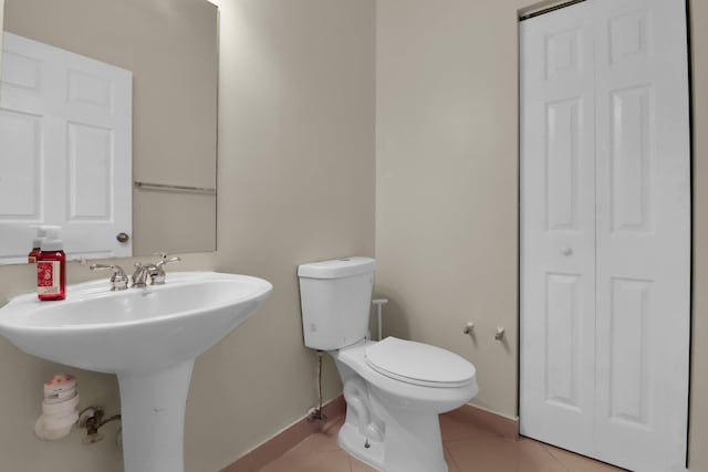 4616 Danson Way, Delray Beach, FL 33445 - half bath with a closet, tile patterned flooring, toilet, a sink, and baseboards