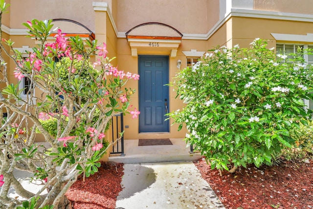 4616 Danson Way, Delray Beach, FL 33445 - doorway to property with stucco siding