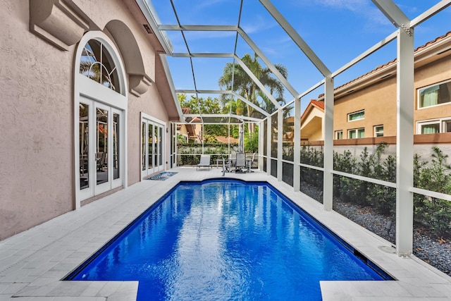 20677 NW 26th Ct, Boca Raton, FL 33434 - outdoor pool featuring french doors, a patio area, and a lanai
