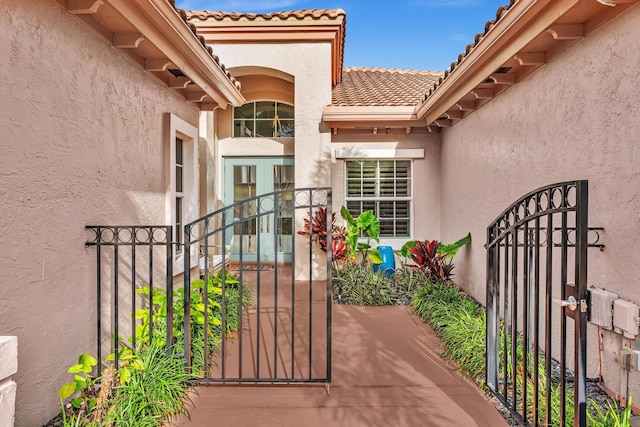 20677 NW 26th Ct, Boca Raton, FL 33434 - property entrance with a gate and stucco siding