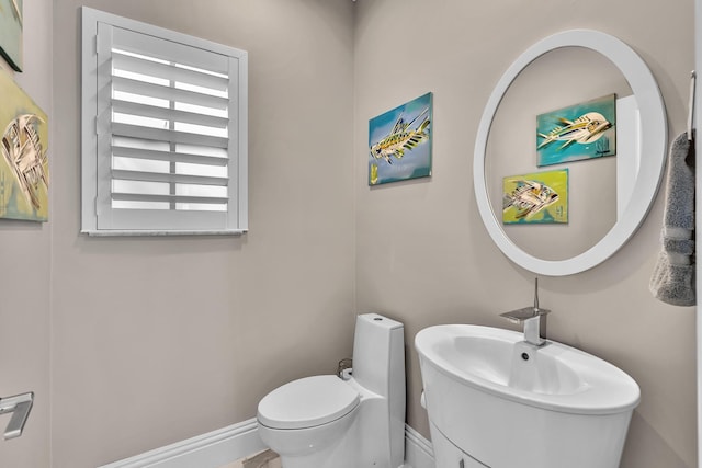 20677 NW 26th Ct, Boca Raton, FL 33434 - bathroom with toilet, baseboards, and vanity