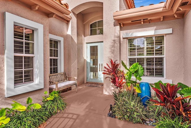 20677 NW 26th Ct, Boca Raton, FL 33434 - property entrance with stucco siding and a porch