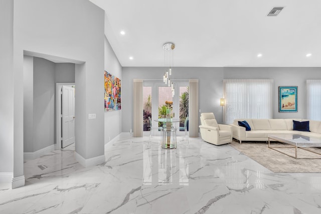 20677 NW 26th Ct, Boca Raton, FL 33434 - living room featuring recessed lighting, marble tiled floors, and baseboards