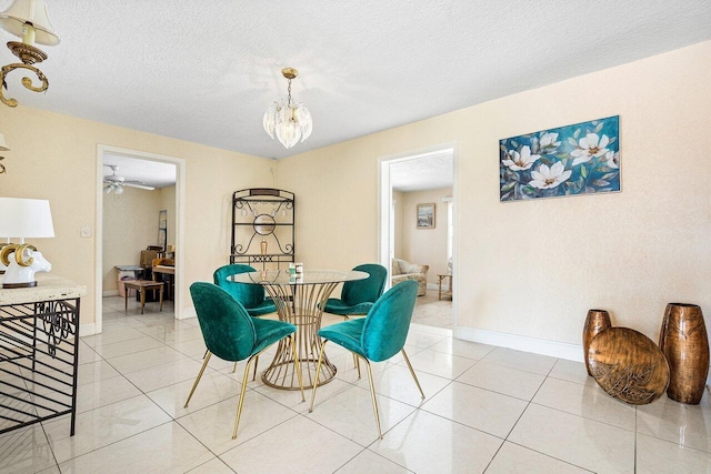 1209 N Australian Ave, West Palm Beach, FL 33401 - dining area with a chandelier, light tile patterned floors, and a textured ceiling