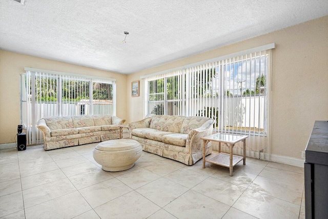 1209 N Australian Ave, West Palm Beach, FL 33401 - living room with a textured ceiling and baseboards