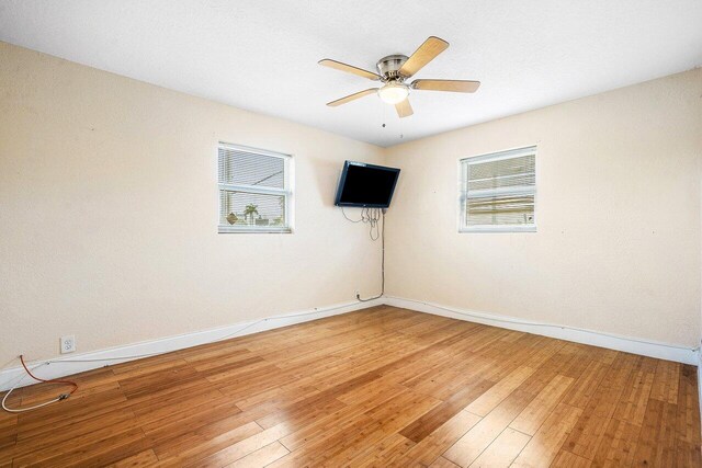 1209 N Australian Ave, West Palm Beach, FL 33401 - spare room with plenty of natural light, ceiling fan, and light wood-type flooring