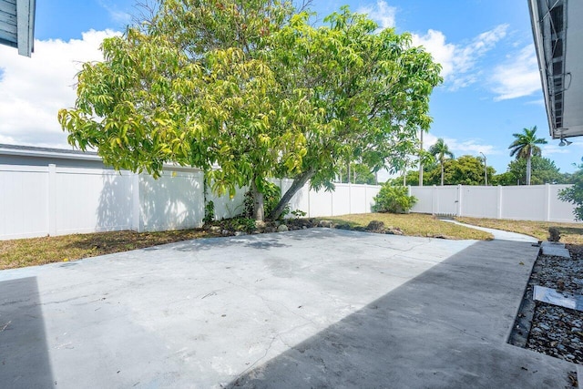 1209 N Australian Ave, West Palm Beach, FL 33401 - fenced backyard with a patio area
