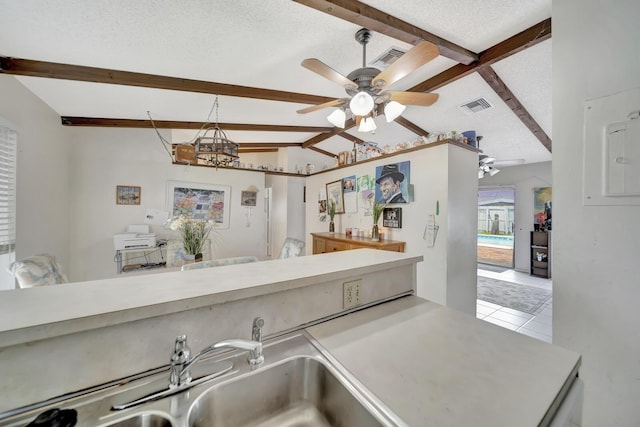 10151 Windtree Ln N, Boca Raton, FL 33428 - kitchen featuring ceiling fan, a textured ceiling, tile patterned flooring, and light countertops