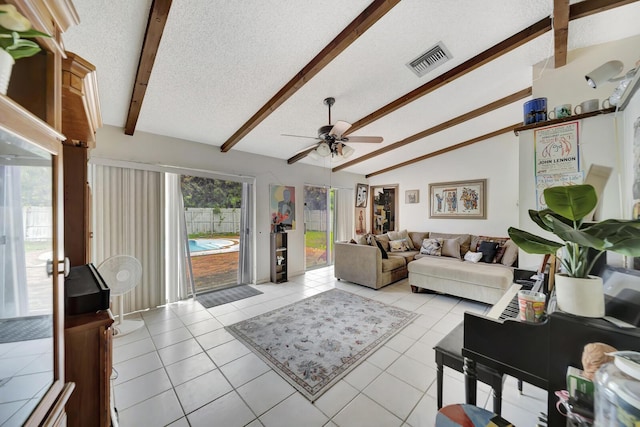 10151 Windtree Ln N, Boca Raton, FL 33428 - living room featuring ceiling fan, light tile patterned floors, and a textured ceiling
