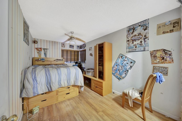 10151 Windtree Ln N, Boca Raton, FL 33428 - bedroom featuring wood finished floors, a textured ceiling, and a ceiling fan