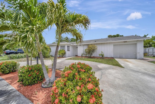 10151 Windtree Ln N, Boca Raton, FL 33428 - ranch-style house featuring driveway and an attached garage
