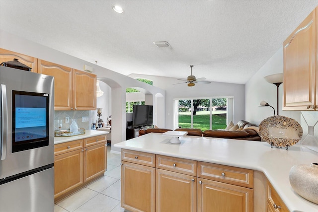 8073 Pelican Harbour Dr, Lake Worth, FL 33467 - kitchen with smart refrigerator, open floor plan, tasteful backsplash, light countertops, and light tile patterned floors