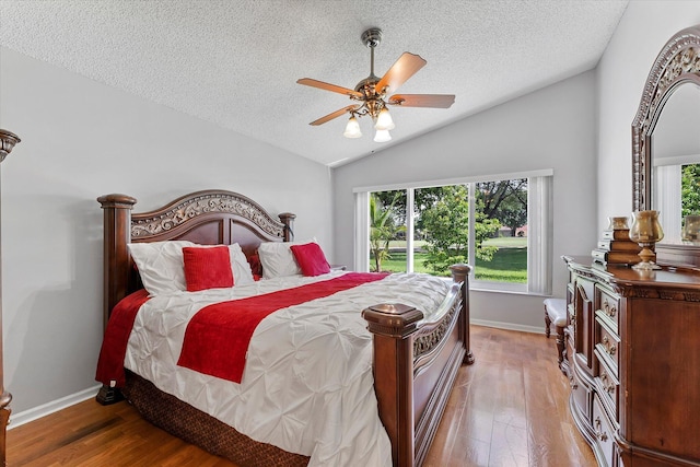 8073 Pelican Harbour Dr, Lake Worth, FL 33467 - bedroom featuring lofted ceiling, a textured ceiling, wood finished floors, and ceiling fan