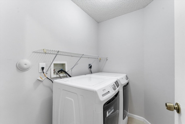 8073 Pelican Harbour Dr, Lake Worth, FL 33467 - laundry room featuring washer and dryer and a textured ceiling