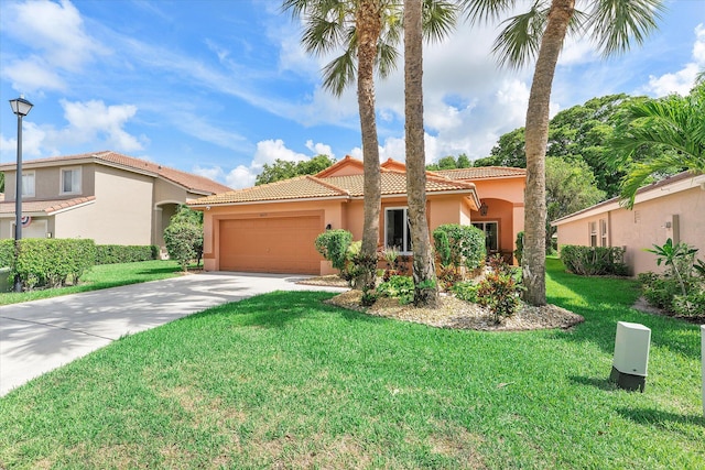 8073 Pelican Harbour Dr, Lake Worth, FL 33467 - mediterranean / spanish-style house featuring a garage, a tiled roof, stucco siding, concrete driveway, and a front yard