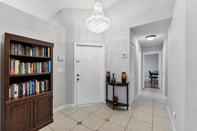 8073 Pelican Harbour Dr, Lake Worth, FL 33467 - foyer featuring a chandelier and light tile patterned flooring