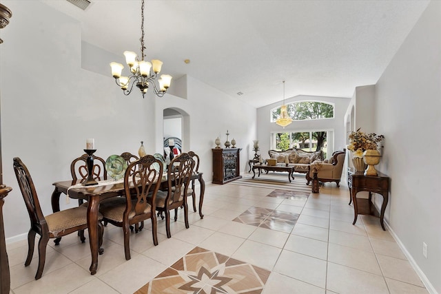 8073 Pelican Harbour Dr, Lake Worth, FL 33467 - dining area featuring a chandelier, arched walkways, lofted ceiling, and light tile patterned floors