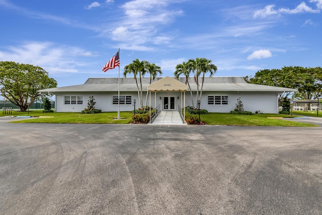 5073 Lakefront Blvd Unit D, Delray Beach, FL 33484 - ranch-style house with a front lawn and stucco siding