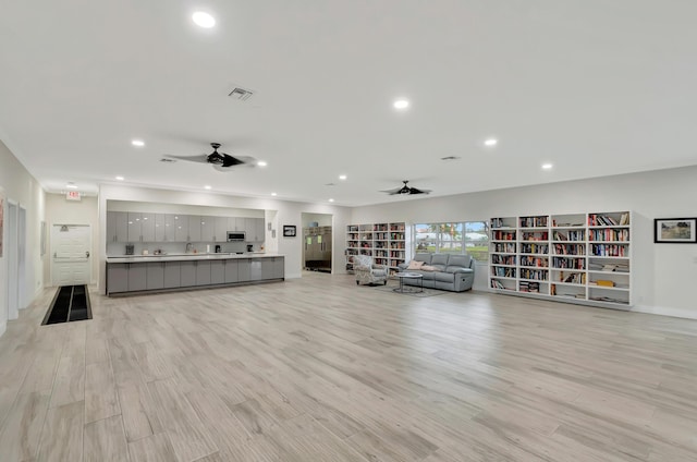 5073 Lakefront Blvd Unit D, Delray Beach, FL 33484 - living area with ceiling fan, recessed lighting, and light wood-style floors