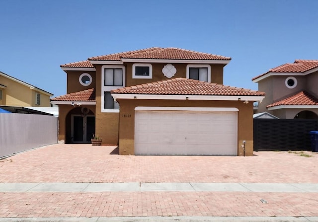 18103 SW 143rd Pl, Miami, FL 33177 - mediterranean / spanish home featuring stucco siding, a tiled roof, and decorative driveway