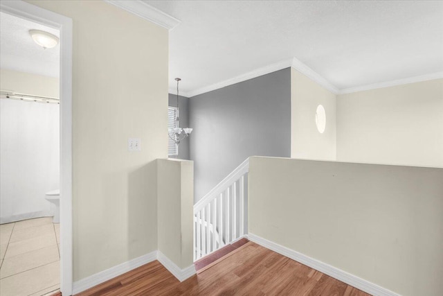 18103 SW 143rd Pl, Miami, FL 33177 - hallway with an upstairs landing, ornamental molding, wood finished floors, and a chandelier