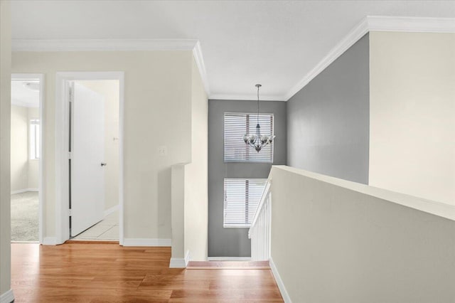 18103 SW 143rd Pl, Miami, FL 33177 - hall featuring a chandelier, an upstairs landing, wood finished floors, and crown molding
