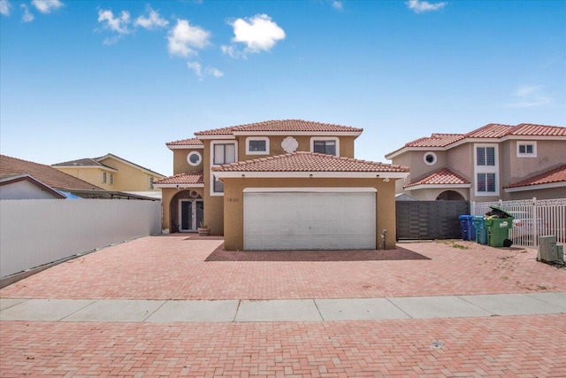 18103 SW 143rd Pl, Miami, FL 33177 - mediterranean / spanish home featuring decorative driveway, an attached garage, stucco siding, and a tile roof