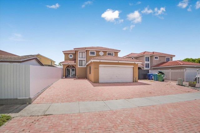 18103 SW 143rd Pl, Miami, FL 33177 - mediterranean / spanish house featuring decorative driveway, a tile roof, an attached garage, and stucco siding