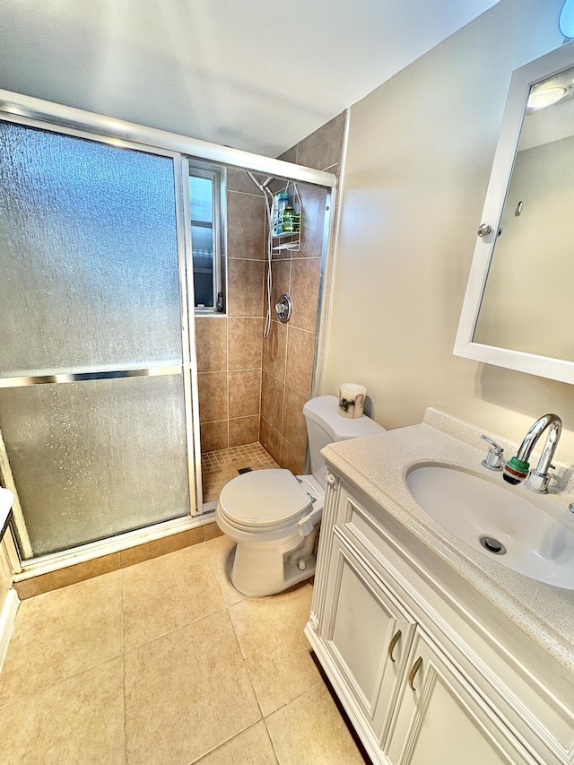 64 Canterbury C, West Palm Beach, FL 33417 - bathroom featuring vanity, a stall shower, and tile patterned flooring
