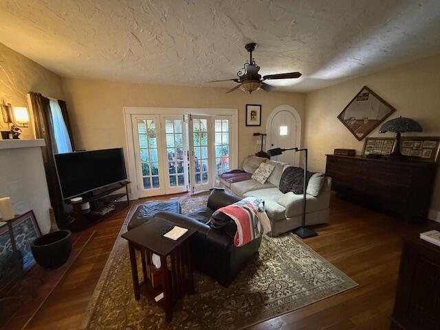 616 37th St, West Palm Beach, FL 33407 - living room featuring ceiling fan, wood finished floors, and a textured ceiling
