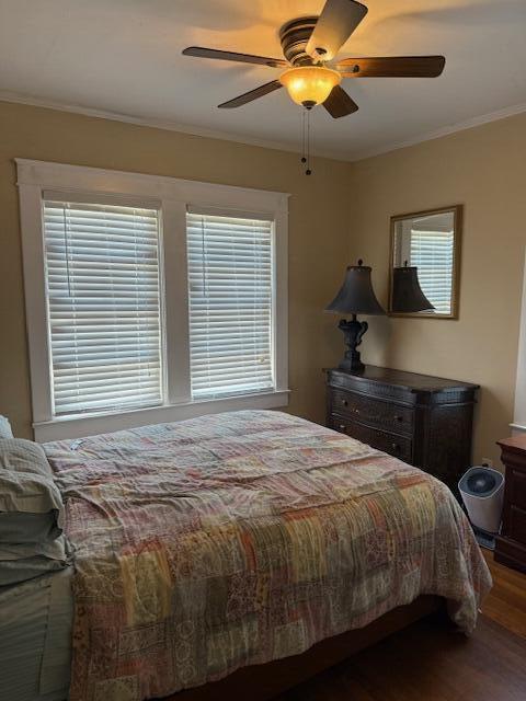 616 37th St, West Palm Beach, FL 33407 - bedroom featuring wood finished floors, crown molding, and a ceiling fan