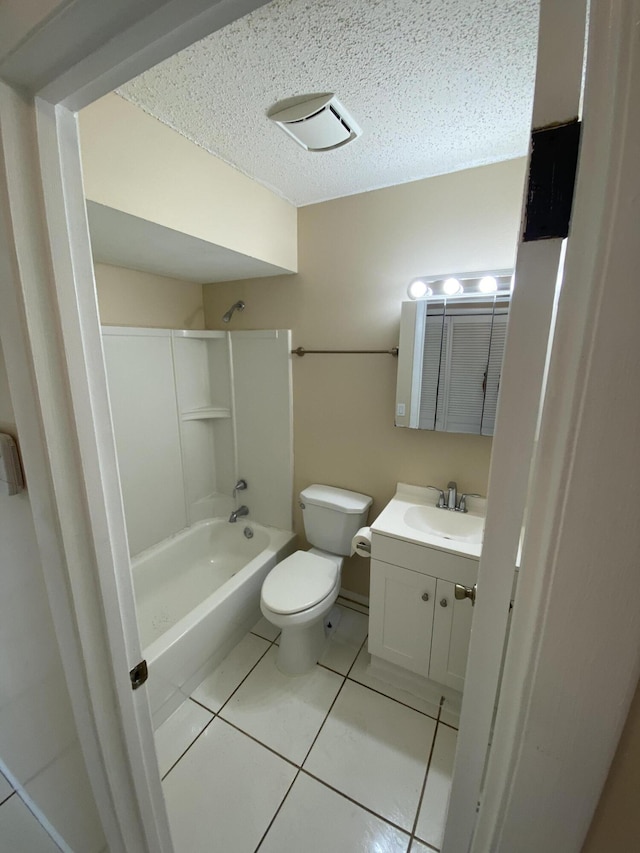 649 SW Heather St, Port Saint Lucie, FL 34983 - bathroom featuring tile patterned floors, vanity, shower / bath combination, toilet, and a textured ceiling