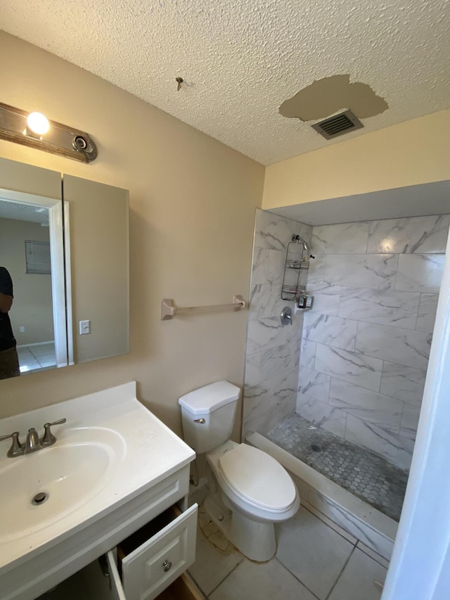 649 SW Heather St, Port Saint Lucie, FL 34983 - bathroom with vanity, a stall shower, a textured ceiling, and toilet