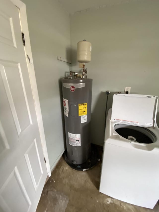 649 SW Heather St, Port Saint Lucie, FL 34983 - utility room featuring washer / clothes dryer and water heater