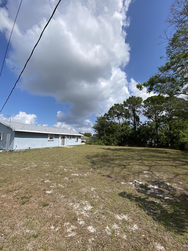 649 SW Heather St, Port Saint Lucie, FL 34983 - view of green lawn