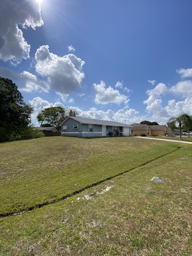 649 SW Heather St, Port Saint Lucie, FL 34983 - view of front of property featuring a front yard