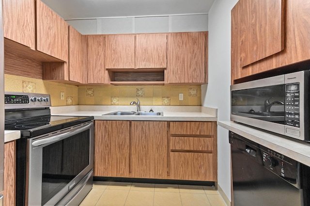 436 Santa Anna Dr, Palm Springs, FL 33461 - kitchen with appliances with stainless steel finishes, light countertops, backsplash, and light tile patterned floors