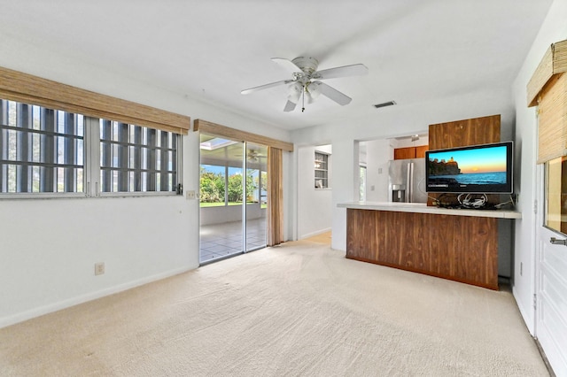 436 Santa Anna Dr, Palm Springs, FL 33461 - unfurnished living room featuring ceiling fan and light colored carpet
