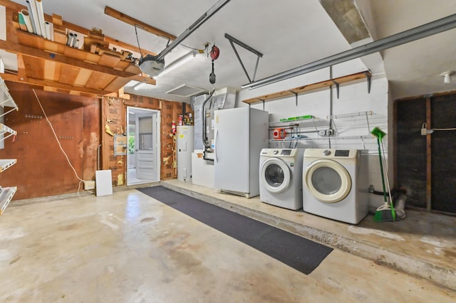 436 Santa Anna Dr, Palm Springs, FL 33461 - garage featuring electric water heater, washer and dryer, and a garage door opener