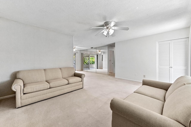 436 Santa Anna Dr, Palm Springs, FL 33461 - living area featuring ceiling fan, light colored carpet, and a textured ceiling